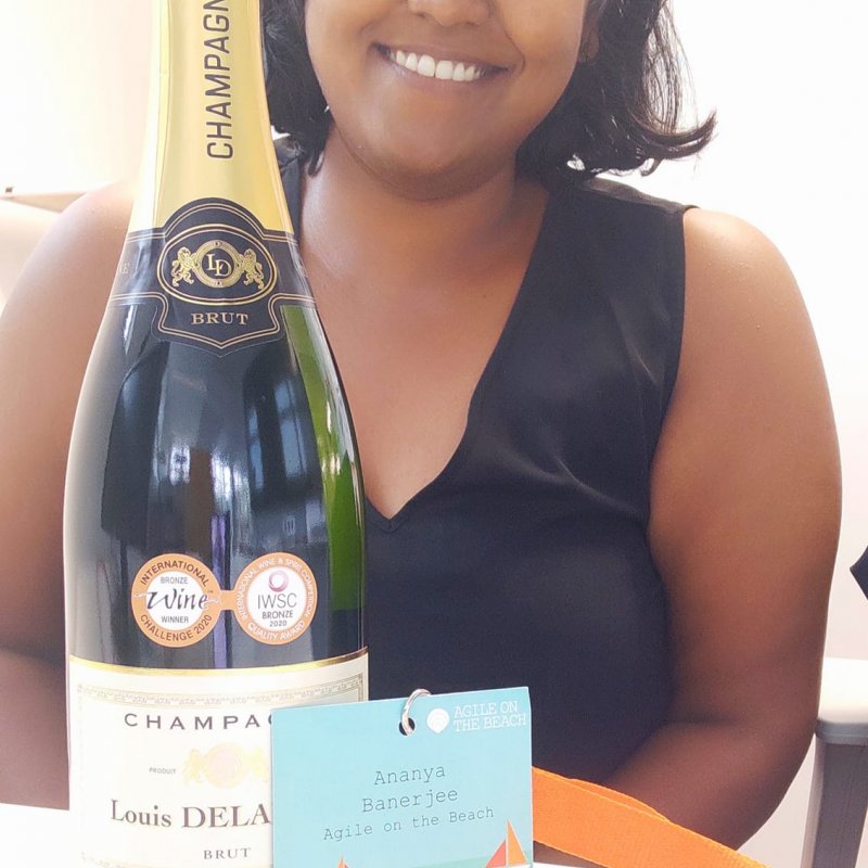 Ananya with congratulatory gift by Agile on the Beach Team